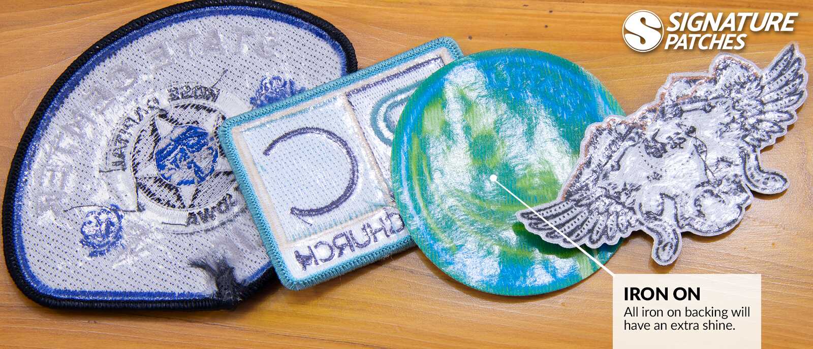 Collection of custom iron on patches with various embroidered designs and backing options