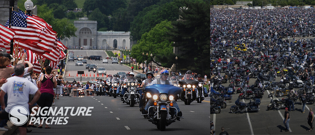 Group of motorcycle riders at biker rally displaying club patches and colors