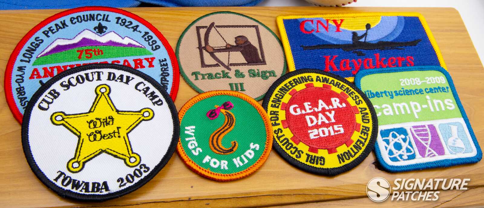 Cub Scout and Webelos patches with council emblems and activity badges